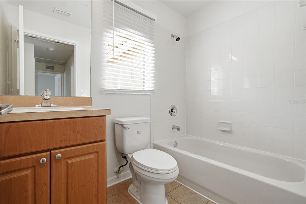 4155 Day Bridge Place Ellenton, FL 34222 - Photo 35 of 42 a bathroom with a sink a toilet and a bathtub