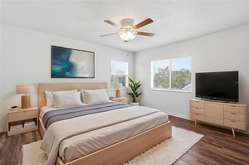 4155 Day Bridge Place Ellenton, FL 34222 - Photo 8 of 42 a bedroom with a bed and a flat screen tv