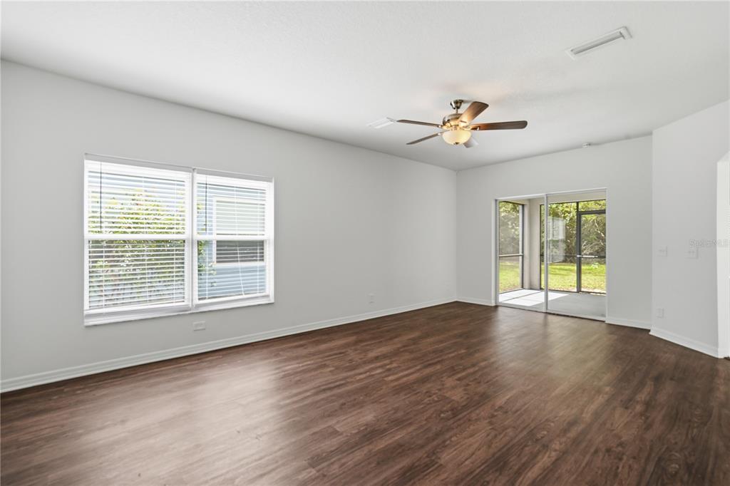 4155 Day Bridge Place Ellenton, FL 34222 - Photo 10 of 42 a view of an empty room with wooden floor and a window