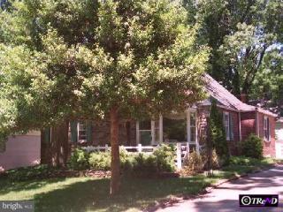 11 Rodney Road Rosemont, PA 19010 - Photo 1 of 1 a front view of a house with garden