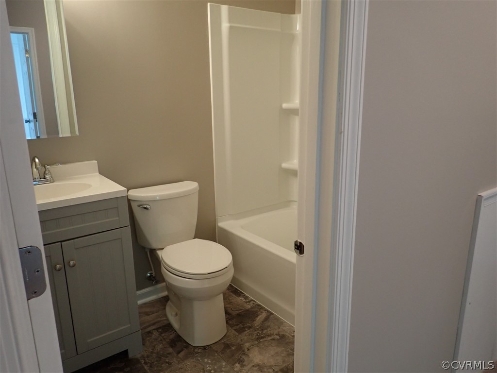 4905 Court Ridge Terrace Midlothian, VA 23112 - Photo 20 of 20 a white toilet sitting next to a bathroom sink