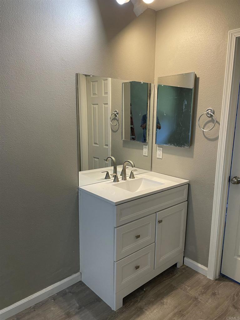 9717 Winter Gardens Boulevard, Unit 194 Lakeside, CA 92040 - Photo 15 of 19 a bathroom with a sink and a mirror