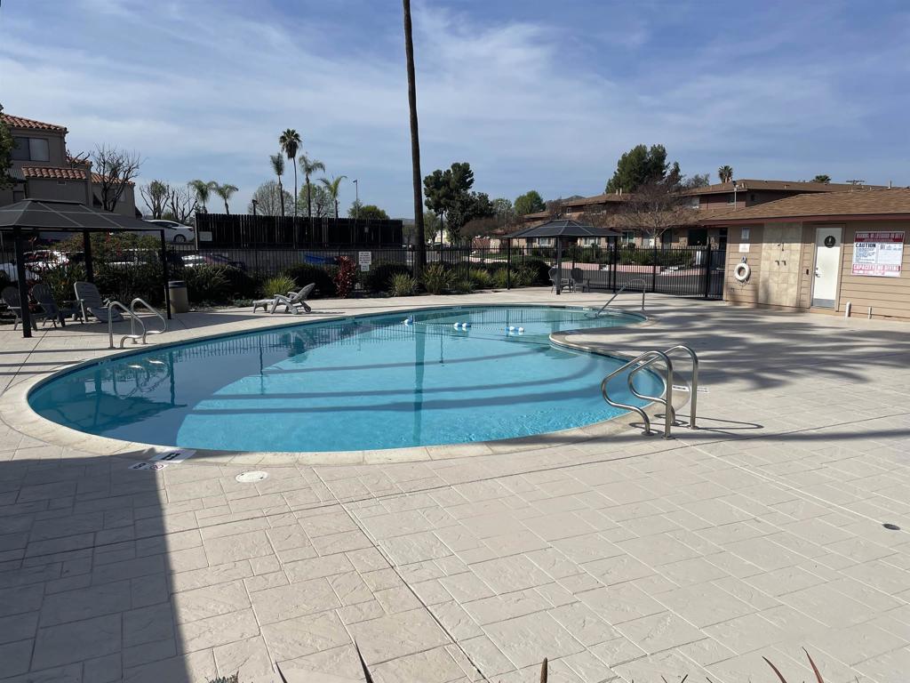 9717 Winter Gardens Boulevard, Unit 194 Lakeside, CA 92040 - Photo 18 of 19 a view of a swimming pool with a lounge chair