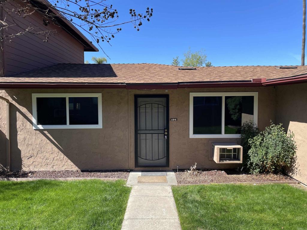9717 Winter Gardens Boulevard, Unit 194 Lakeside, CA 92040 - Photo 2 of 19 a front view of a house with a garden