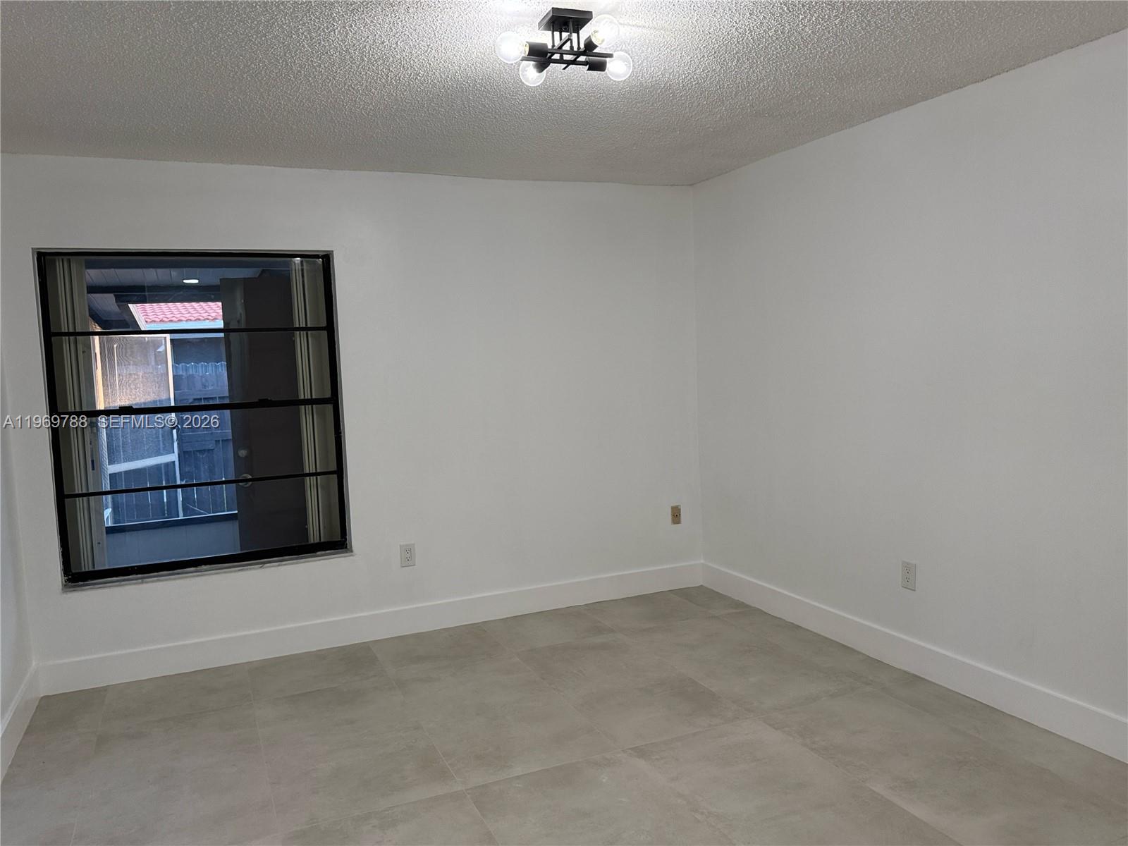 15332 Southwest 80th Lane, Unit 15332 Miami, FL 33193 - Photo 13 of 16 an empty room with a empty space
