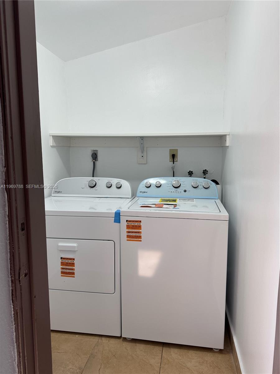 15332 Southwest 80th Lane, Unit 15332 Miami, FL 33193 - Photo 14 of 16 a utility room with dryer and washer