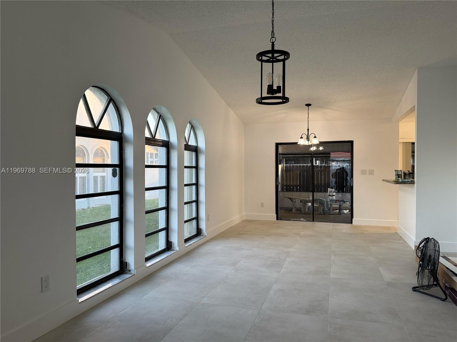 15332 Southwest 80th Lane, Unit 15332 Miami, FL 33193 - Photo 2 of 16 a view of a livingroom with furniture and windows