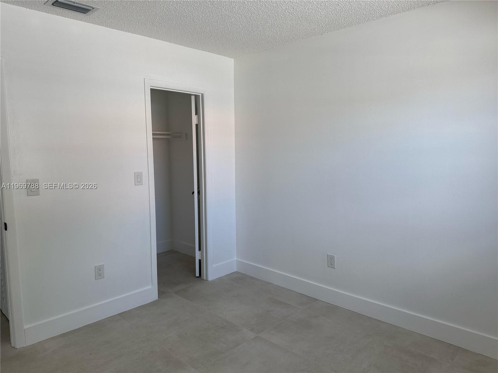 15332 Southwest 80th Lane, Unit 15332 Miami, FL 33193 - Photo 7 of 16 an empty room with closet
