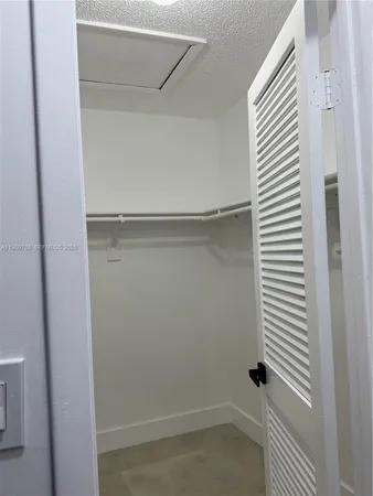 a view of a room with a white door