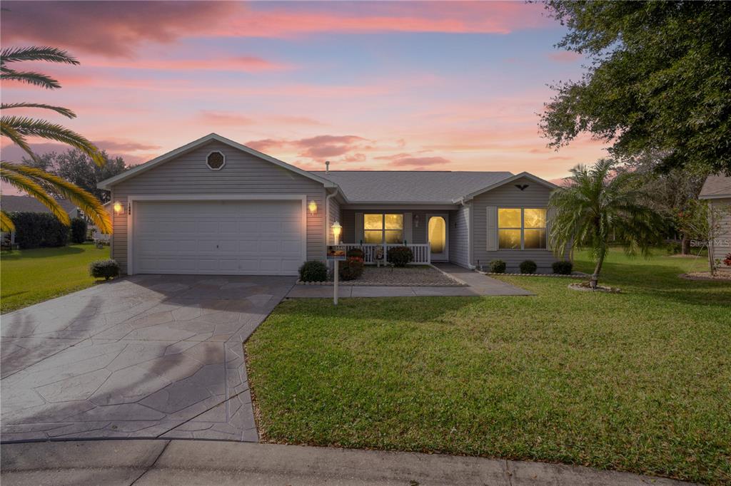 1648 Perdido Bay The Villages, FL 32162 - Photo 1 of 1 Sunset view of the Front Elevation of the BEAUTIFUL 3 Bedroom, 2 Bath split bedroom home in The Village of Sunset Point