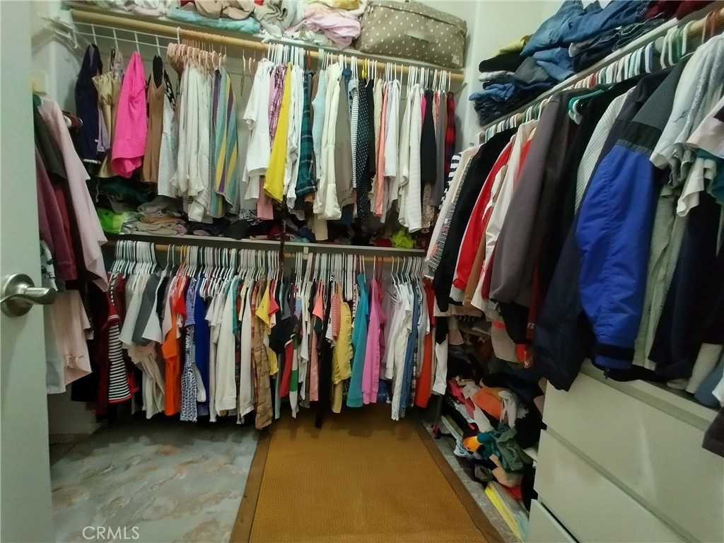 11811 Cramer Road Yucaipa, CA 92399 - Photo 32 of 56 a view of walk in closet with clothes