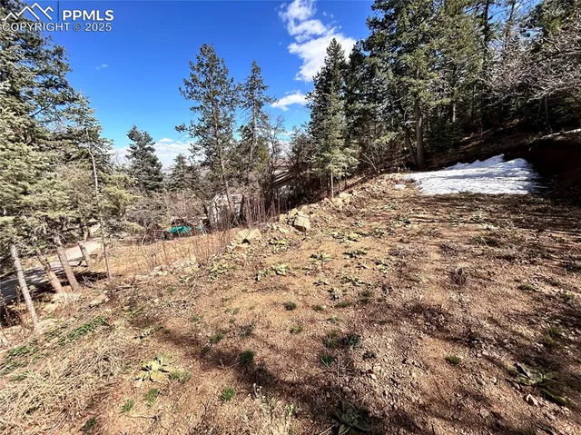 a view of a snow covered with snow in the background