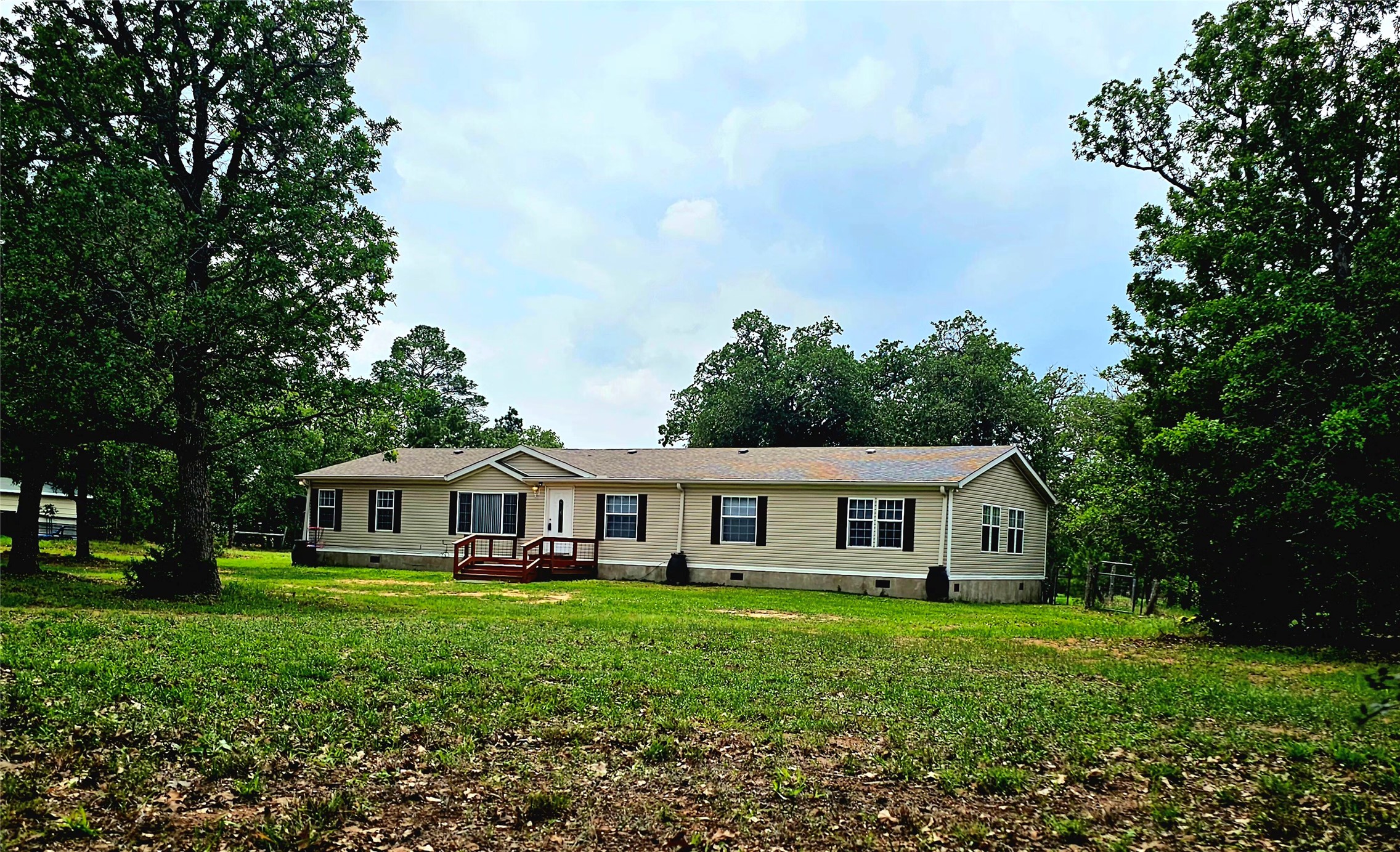 552 South Old Potato Road Paige, TX 78659 - Photo 1 of 40 a front view of house with yard and green space