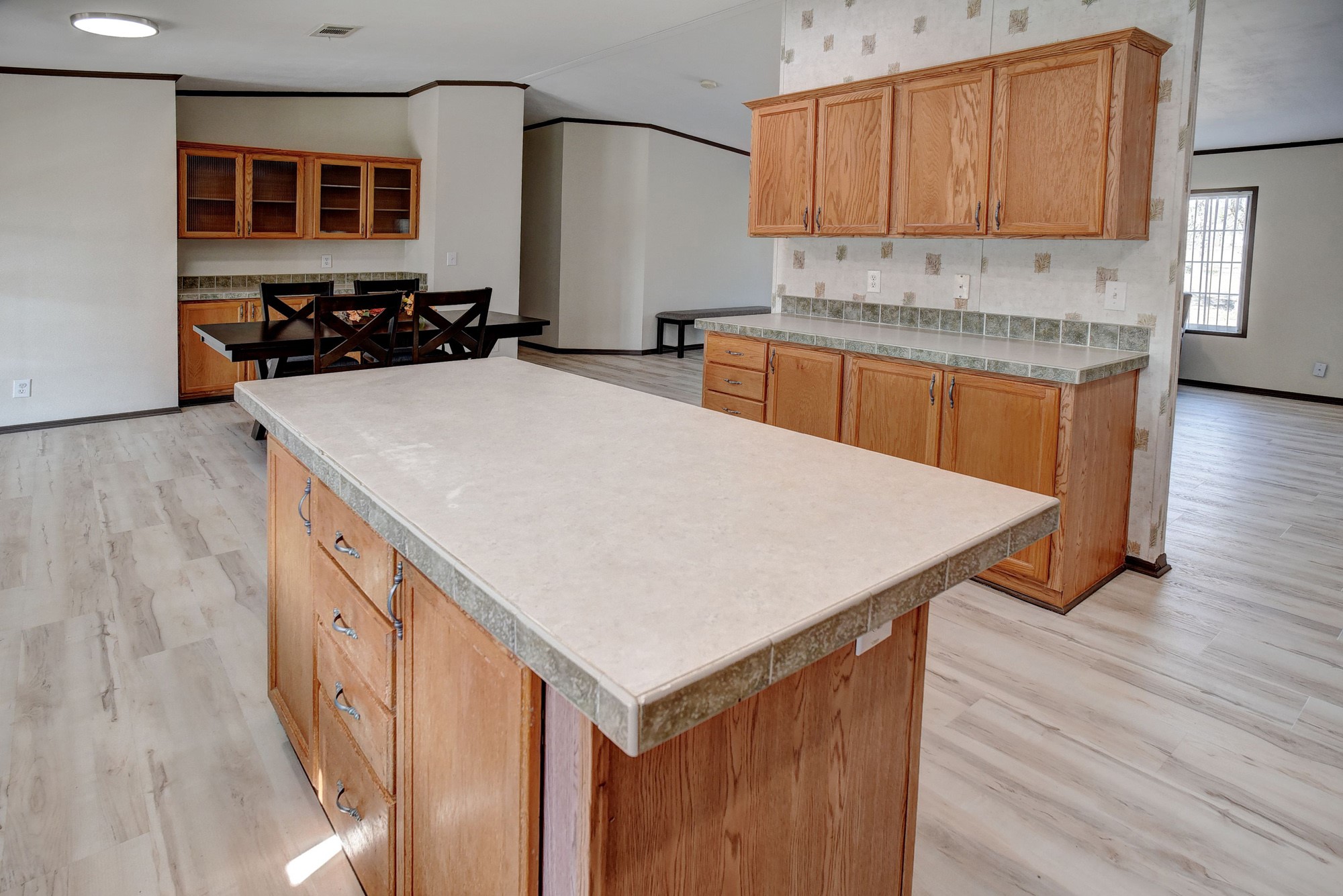 552 South Old Potato Road Paige, TX 78659 - Photo 13 of 40 a kitchen with a sink a cabinets and wooden floor
