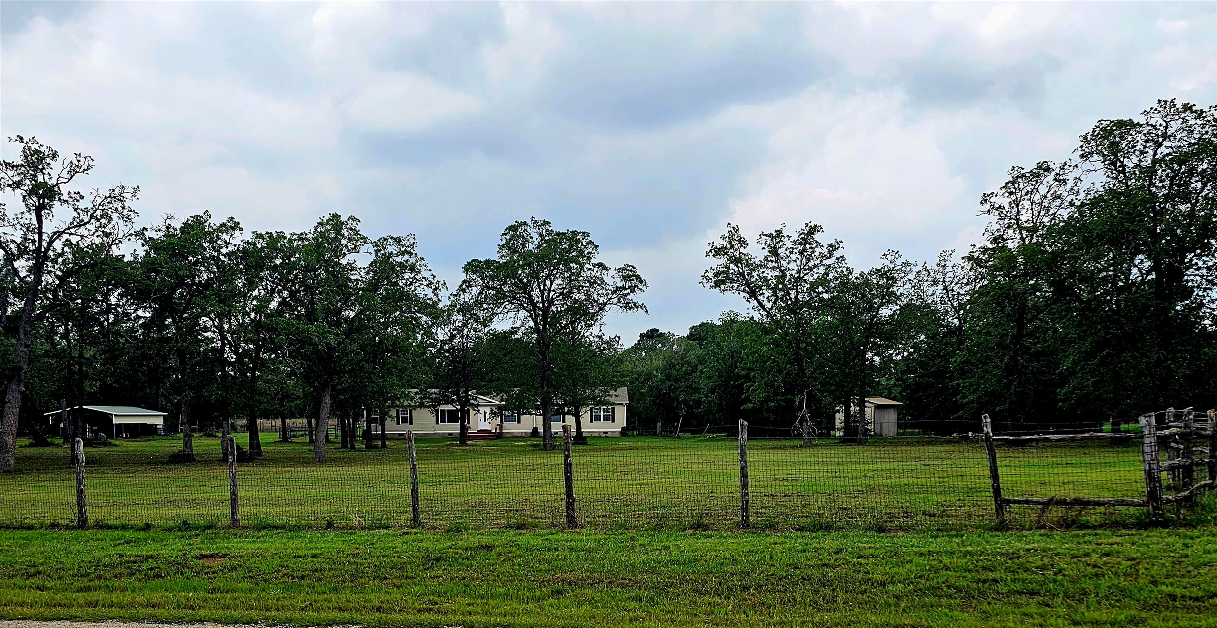 552 South Old Potato Road Paige, TX 78659 - Photo 2 of 40 a view of a park and trees in the background