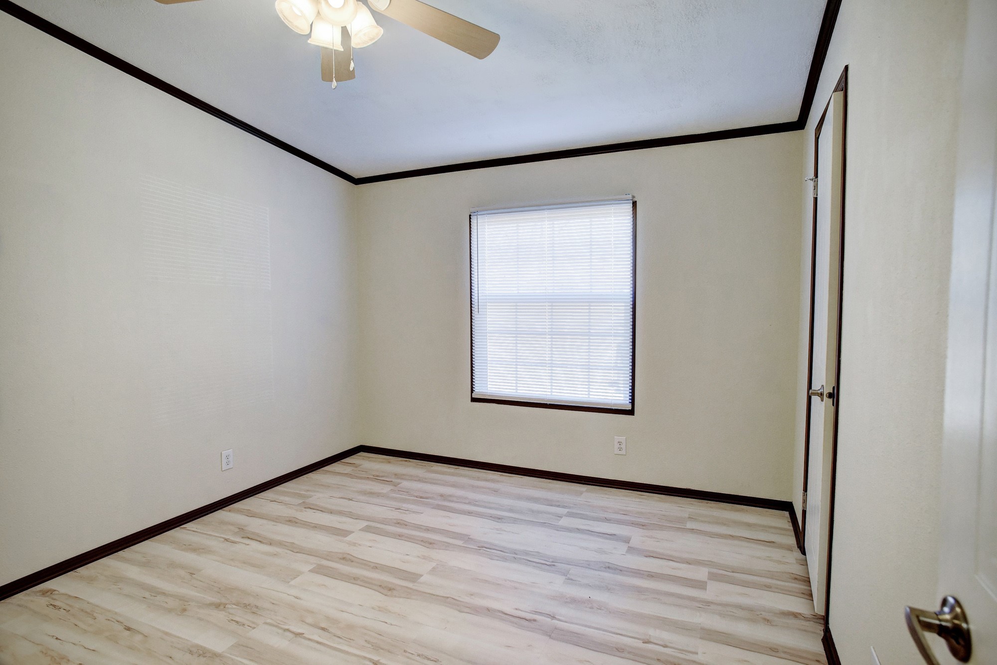 552 South Old Potato Road Paige, TX 78659 - Photo 23 of 40 an empty room with a chandelier fan