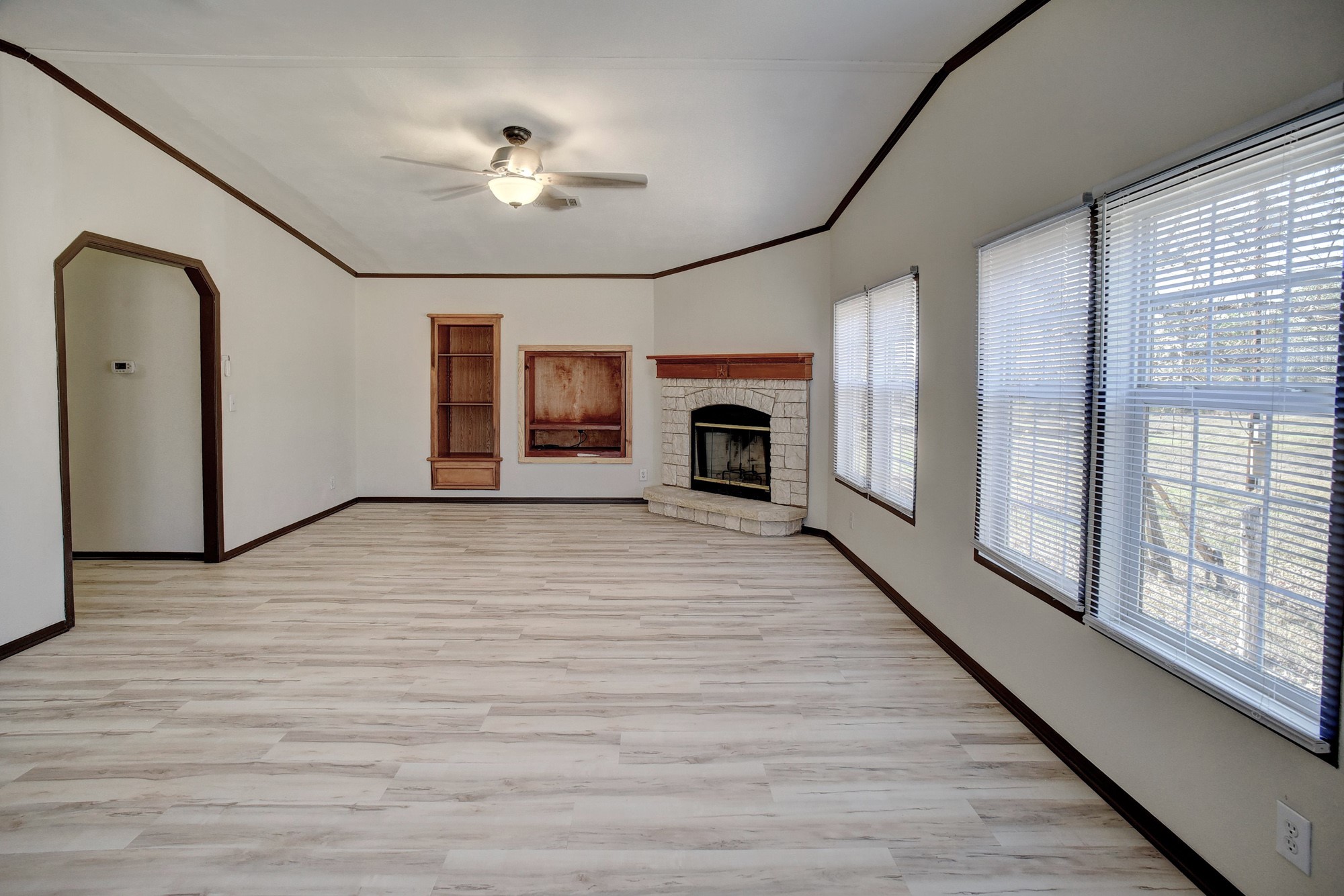 552 South Old Potato Road Paige, TX 78659 - Photo 28 of 40 a view of empty room with wooden floor and fan