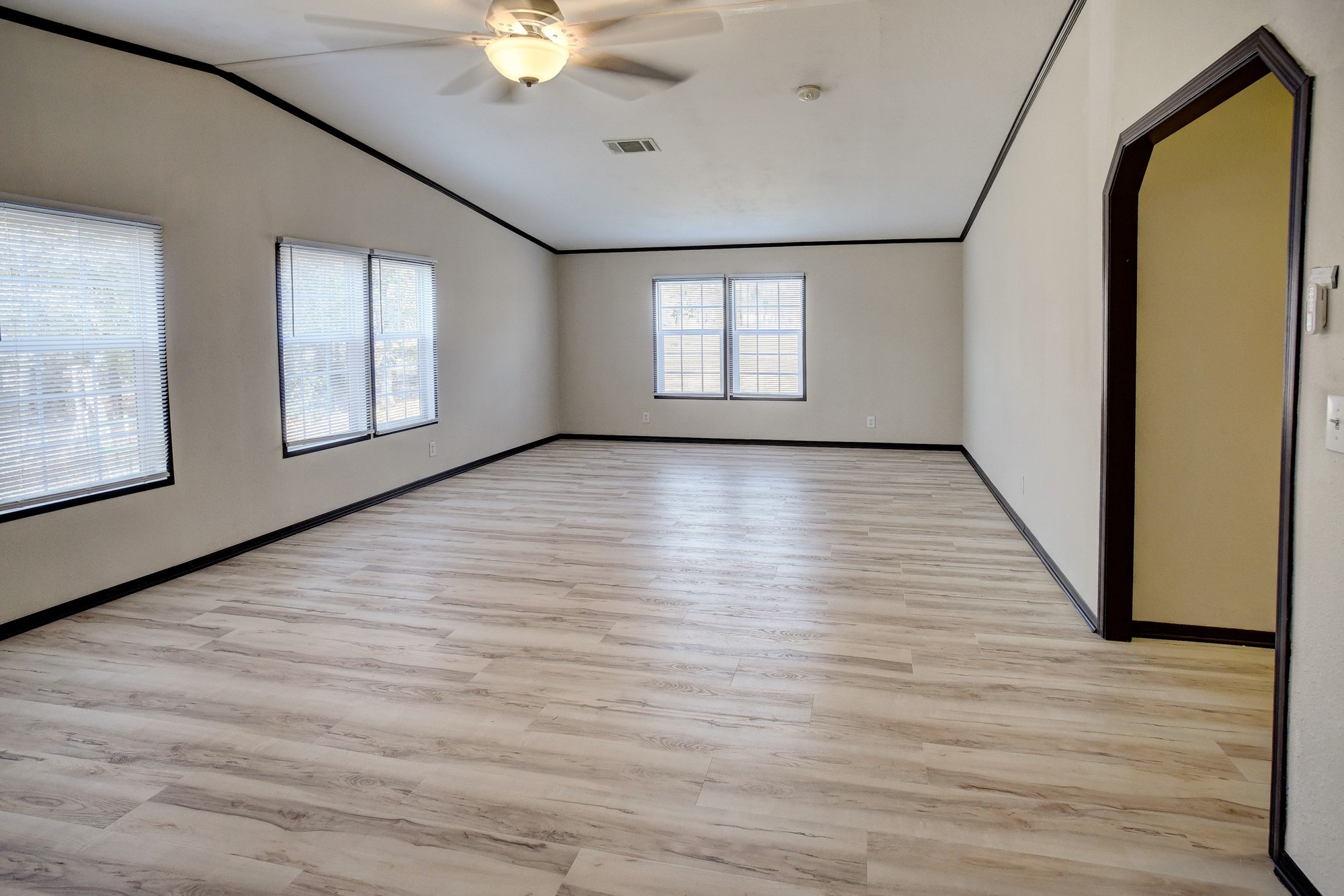 552 South Old Potato Road Paige, TX 78659 - Photo 29 of 40 a view of an empty room with wooden floor and a window