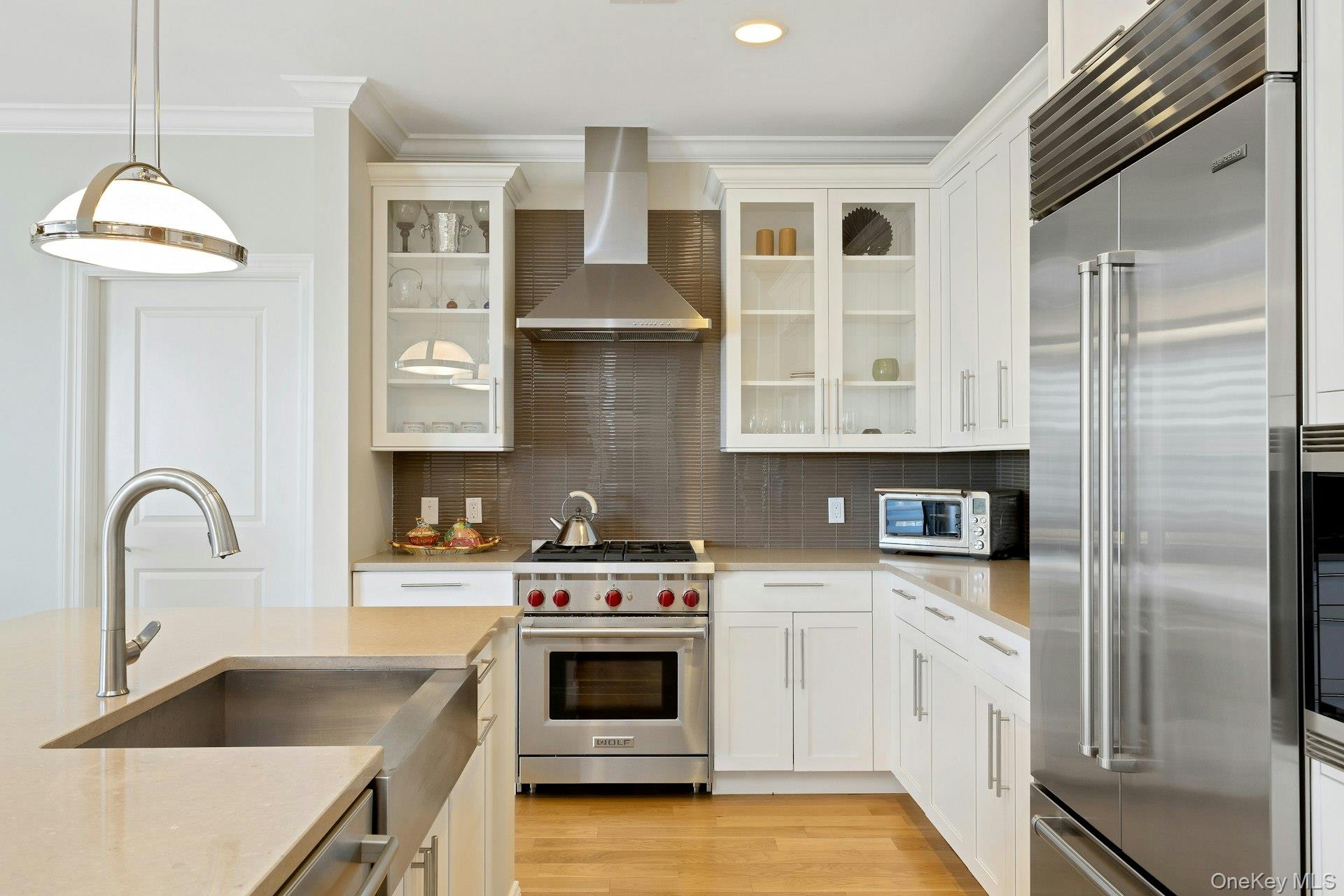 18 Rivers Edge Drive, Unit 305 Tarrytown, NY 10591 - Photo 12 of 34 a kitchen with granite countertop a stove and a sink