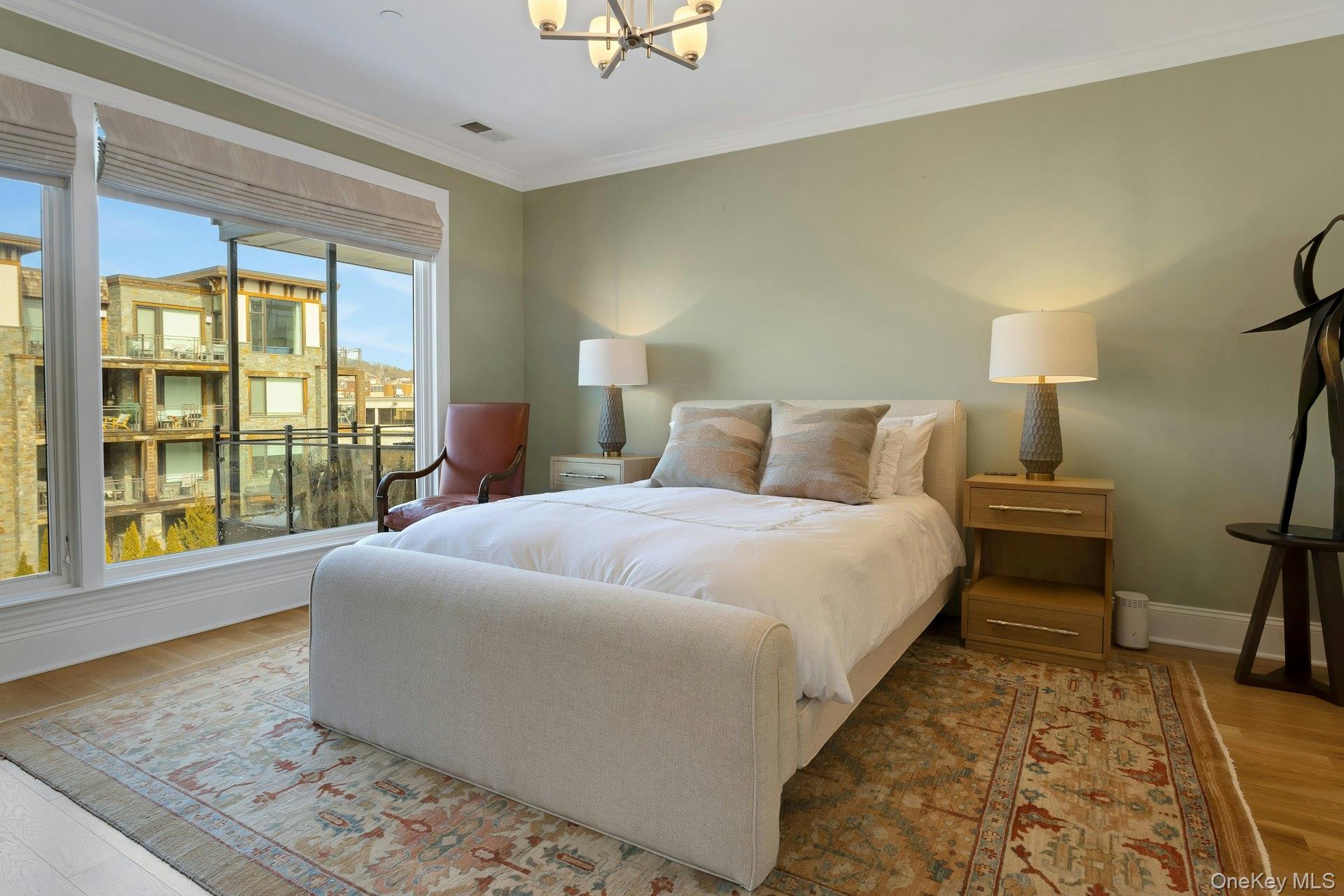 18 Rivers Edge Drive, Unit 305 Tarrytown, NY 10591 - Photo 15 of 34 a bedroom with a bed and a large window