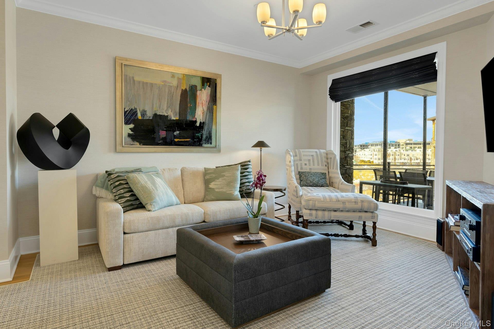18 Rivers Edge Drive, Unit 305 Tarrytown, NY 10591 - Photo 22 of 34 a living room with furniture and a flat screen tv