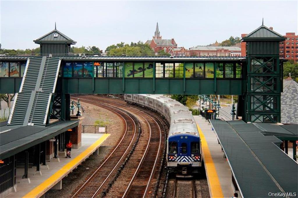 18 Rivers Edge Drive, Unit 305 Tarrytown, NY 10591 - Photo 27 of 34 a view of a balcony with two chairs and wooden floor
