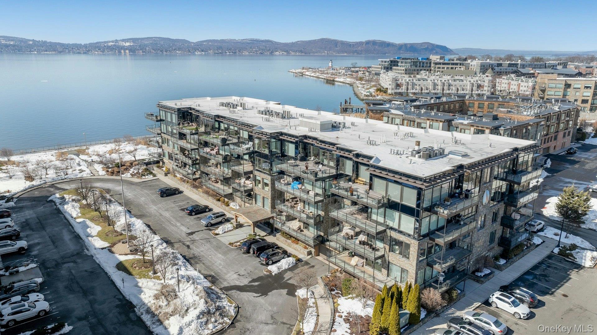 18 Rivers Edge Drive, Unit 305 Tarrytown, NY 10591 - Photo 29 of 34 a view of a lake with a mountain