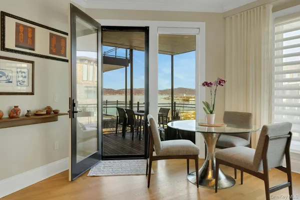 a view of a dining room with furniture window and outside view