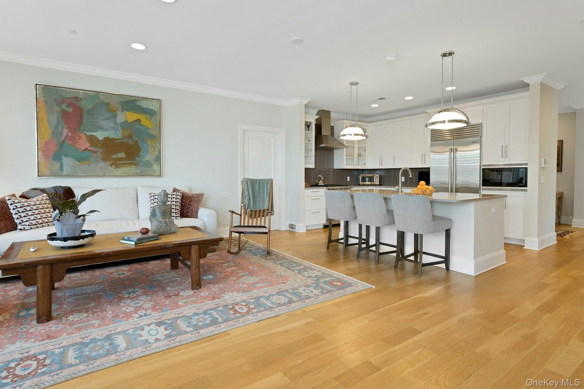 18 Rivers Edge Drive, Unit 305 Tarrytown, NY 10591 - Photo 10 of 34 a living room with lots of furniture and kitchen view