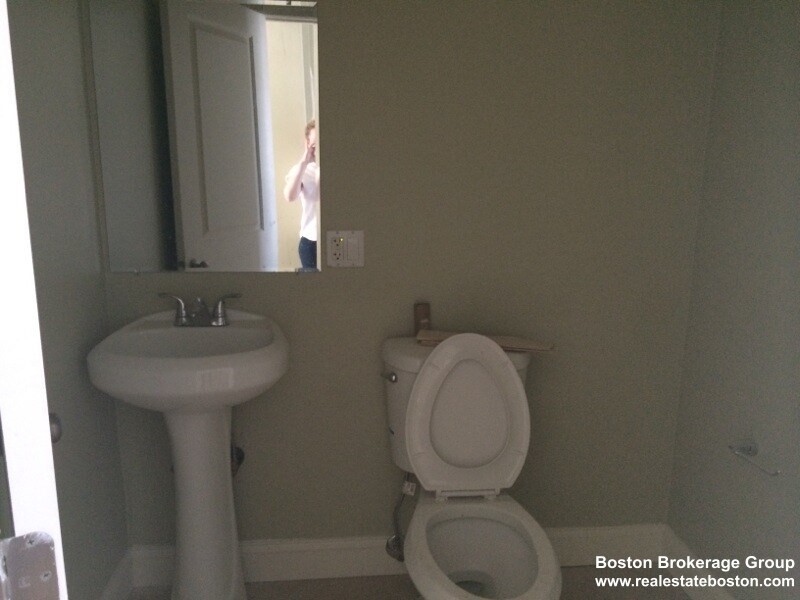 35 Forbes Street, Unit 1 Boston, MA 02130 - Photo 6 of 6 a bathroom with a toilet sink and mirror