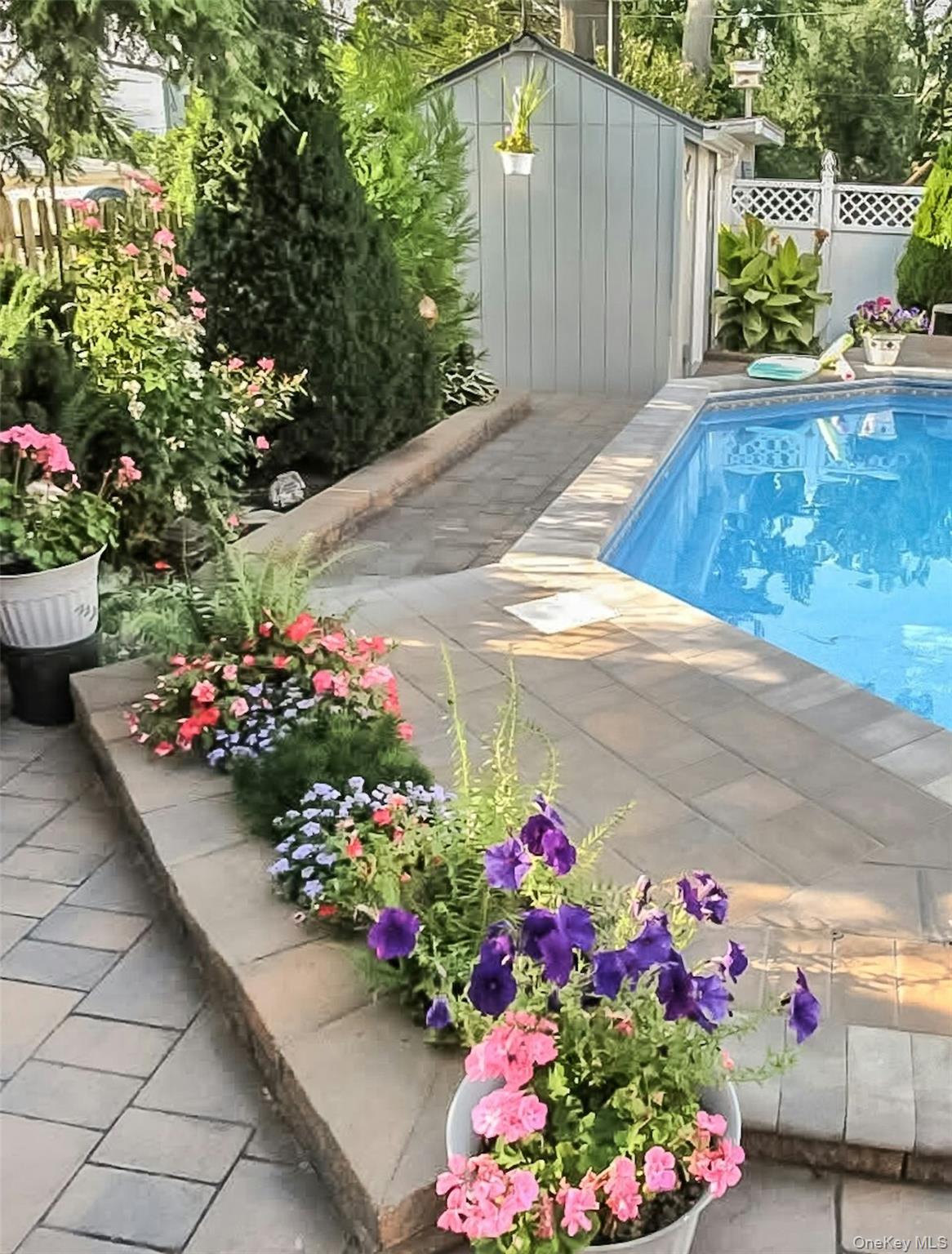 5 Sherwood Road Glen Cove, NY 11542 - Photo 26 of 26 View of pool featuring a storage unit