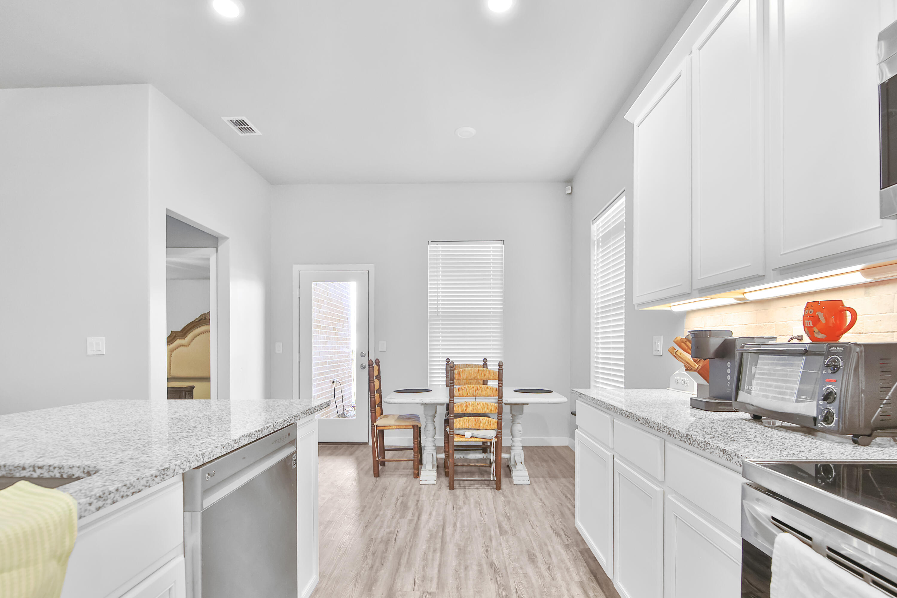 1716 133rd Street Lubbock, TX 79423 - Photo 25 of 37 a kitchen with stainless steel appliances granite countertop wooden cabinets and a granite counter tops