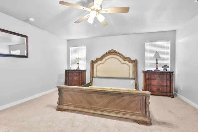 a bedroom with a bed and a dresser