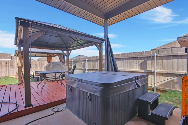 a table and chairs in the balcony
