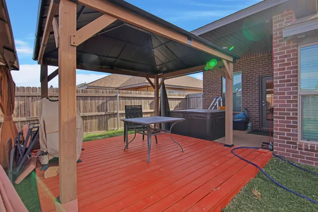 a patio with table and chairs