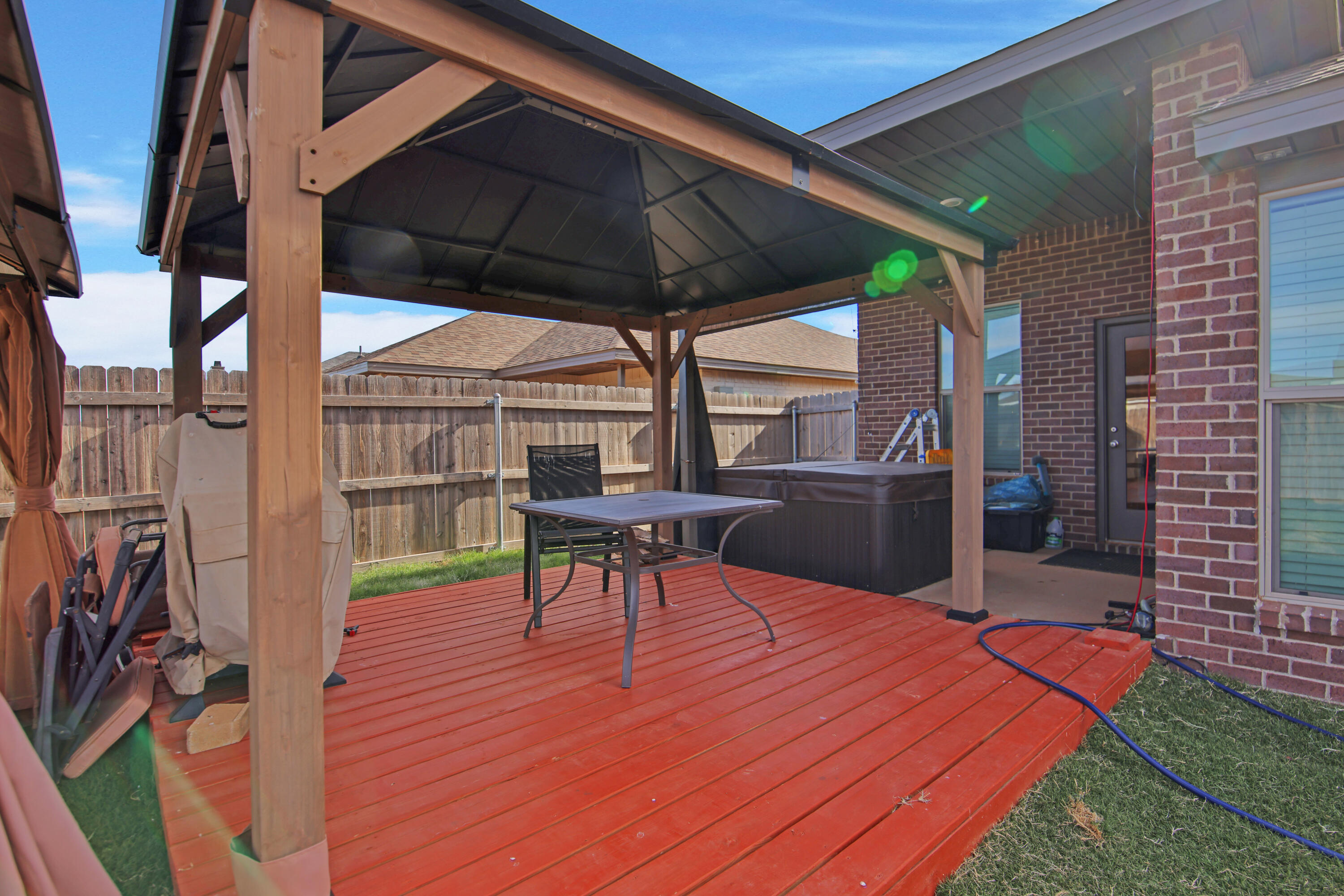 1716 133rd Street Lubbock, TX 79423 - Photo 36 of 37 a patio with table and chairs
