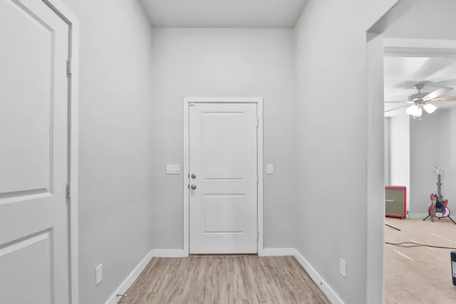 a view of a room that has a bed