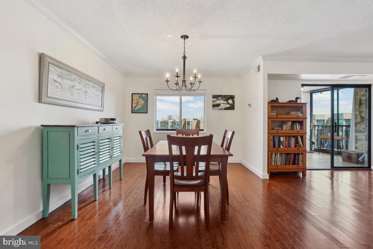 5902 Mt Eagle Drive, Unit 1615 Alexandria, VA 22303 - Photo 19 of 48 a view of a dining room with furniture window and wooden floor