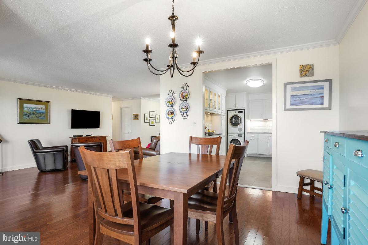 5902 Mt Eagle Drive, Unit 1615 Alexandria, VA 22303 - Photo 20 of 48 a view of a dining room with furniture wooden floor and chandelier