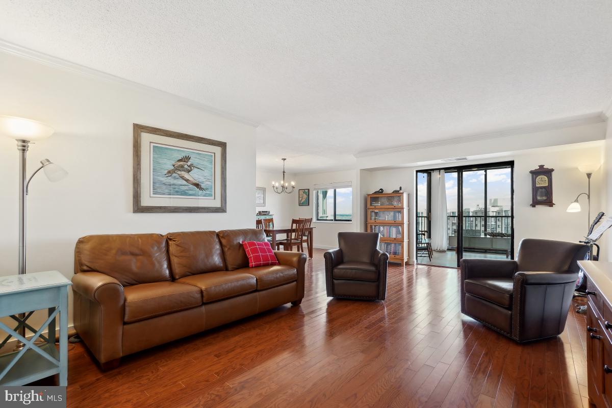 5902 Mt Eagle Drive, Unit 1615 Alexandria, VA 22303 - Photo 2 of 48 a living room with furniture wooden floor and a large window