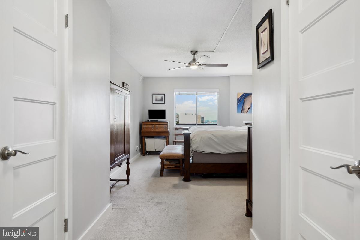 5902 Mt Eagle Drive, Unit 1615 Alexandria, VA 22303 - Photo 29 of 48 a bedroom with furniture and a chandelier