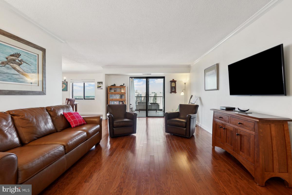 5902 Mt Eagle Drive, Unit 1615 Alexandria, VA 22303 - Photo 8 of 48 a living room with furniture and a flat screen tv