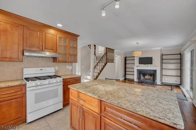 a view of a room with a wooden floor and a window