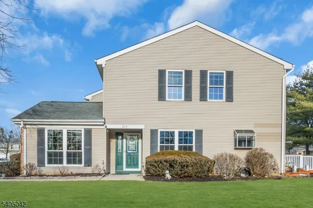 a view of a house with backyard