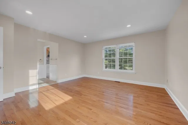 a bathroom with a granite countertop sink a mirror and vanity