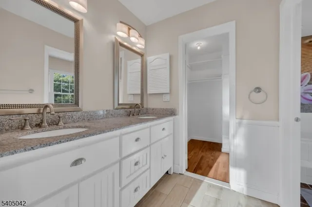 a view of a park with a large trees