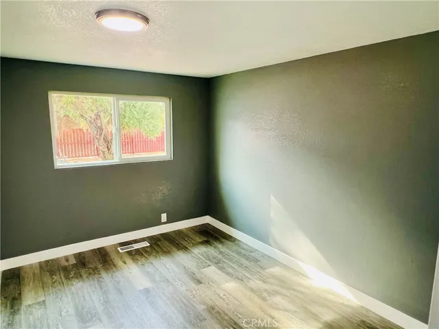 a bathroom with a toilet a sink a mirror a bathtub and vanity