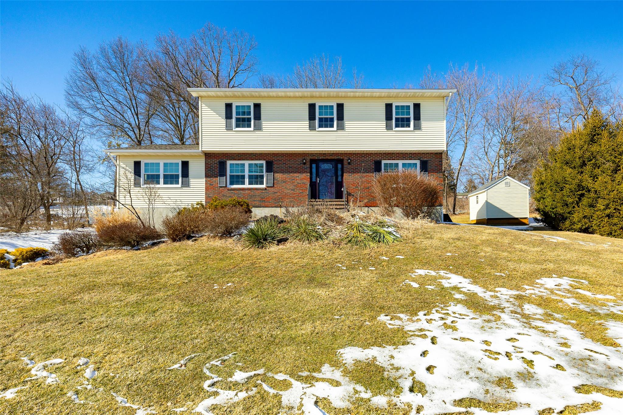 a front view of a house with a yard