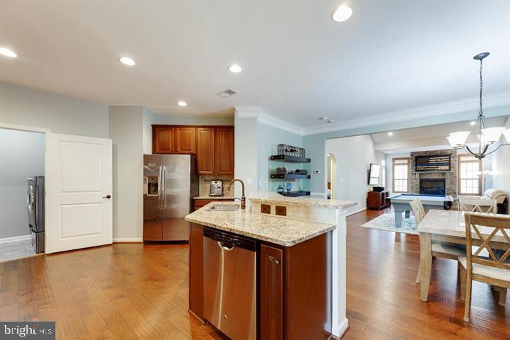 24876 Helms Terrace Aldie, VA 20105 - Photo 13 of 45 a large kitchen with a table and chairs