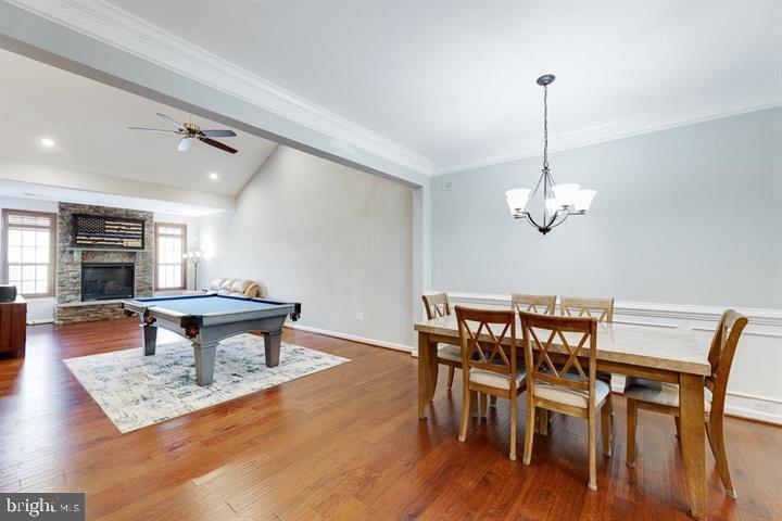 24876 Helms Terrace Aldie, VA 20105 - Photo 15 of 45 a view of a dining room with furniture wooden floor and chandelier
